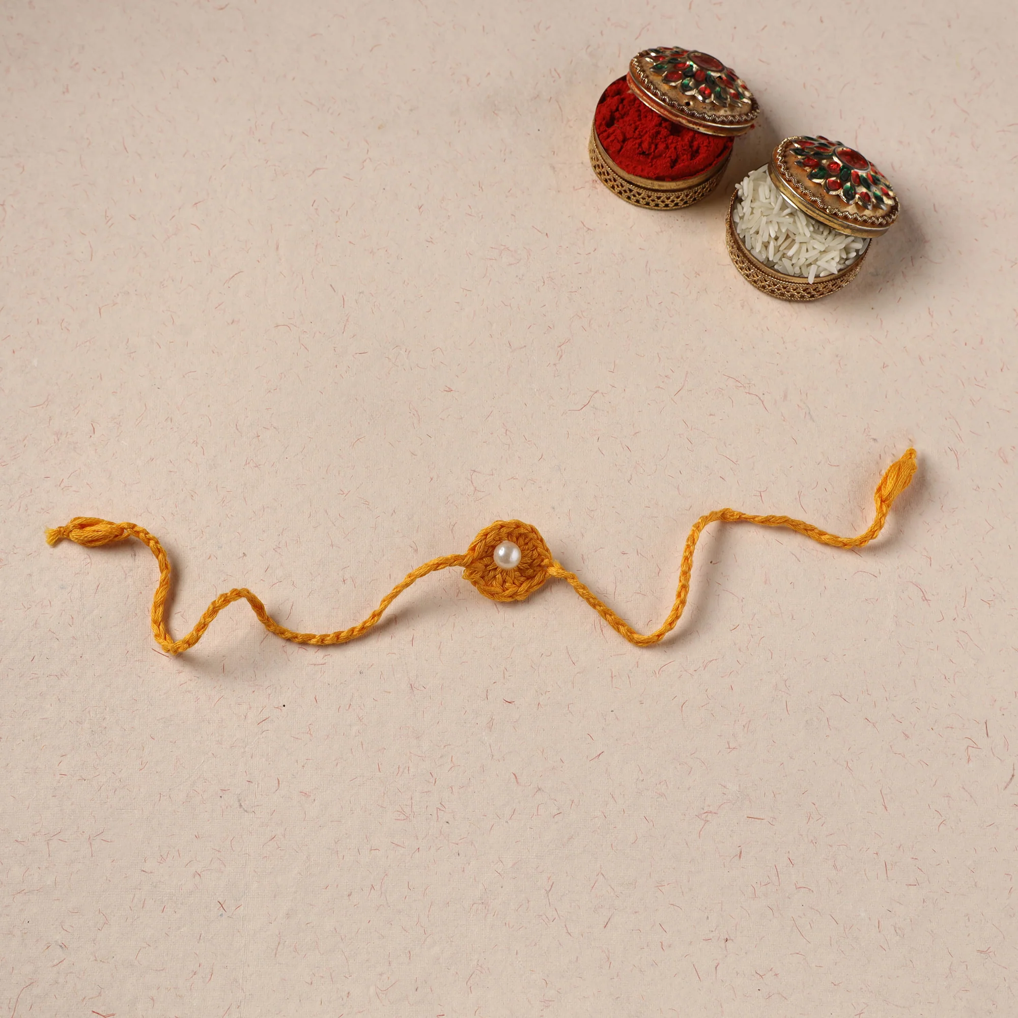 Handmade Crochet Pearl Work Rakhi 25